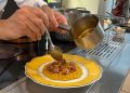La tradizione del Natale si celebra anche a tavola con i tipici sapori lombardi 'rivisitati dallo chef stellato Alessandro Negrini . nella foto la preparazione del Risotto giallo allo zafferano.